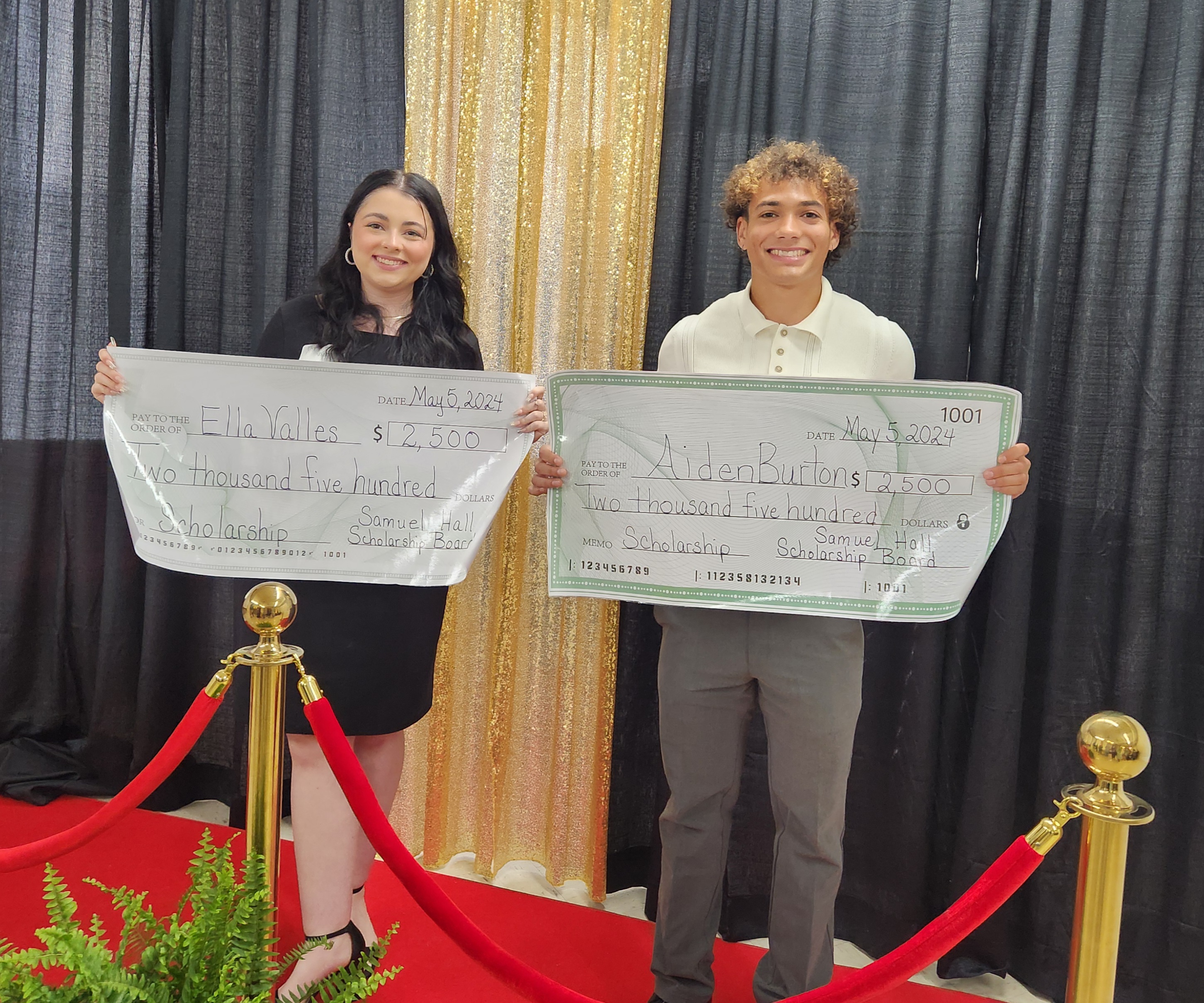 2024 scholarship recipients holding their $2,500 scholarship checks